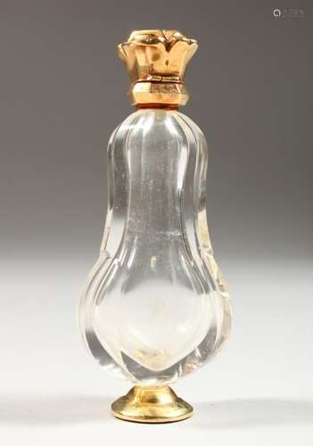 A GOLD TOP CUT GLASS SCENT BOTTLE. 4ins high.