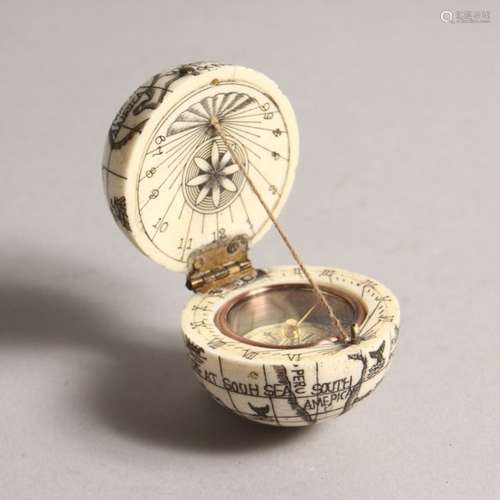 A BONE FOLDING GLOBE/COMPASS. 1.75ins diameter.