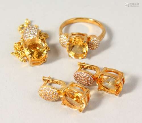 A SILVER AND GOLD PLATED CITRINE PENDANT, EARRINGS AND RING.