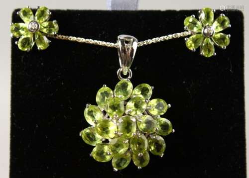 A SILVER PERIDOT SET PENDANT, on chain, and EAR STUDS.