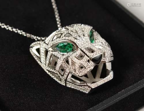 A CARTIER DESIGN SILVER PANTHER PENDANT ON CHAIN.