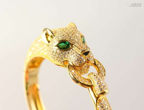 A GOOD SILVER AND GOLD PLATED PANTHER BANGLE.