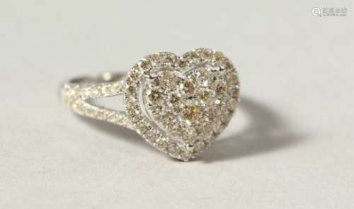 A GOOD 18CT WHITE GOLD DIAMOND HEART SHAPED CLUSTER RING.