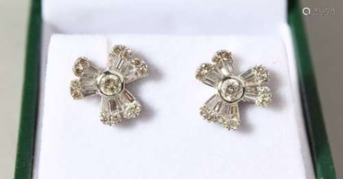 A PAIR OF 18CT WHITE GOLD FLOWER HEAD EARRINGS.