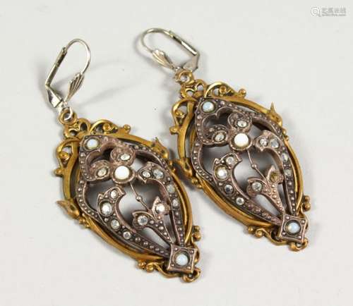 A PAIR OF GILT METAL CUT STEEL AND OPAL EARRINGS. 2ins high.