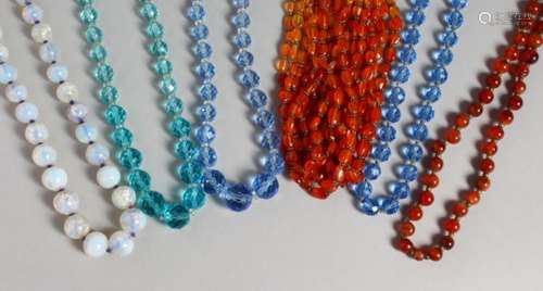 SIX VARIOUS GLASS BEAD NECKLACES.