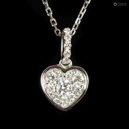 AN 18CT WHITE GOLD HEART SHAPED DIAMOND SET PENDANT AND CHAIN.