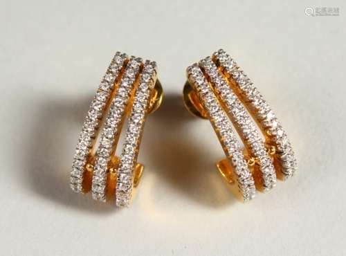 A PAIR OF 18CT YELLOW GOLD DIAMOND SET EARRINGS.