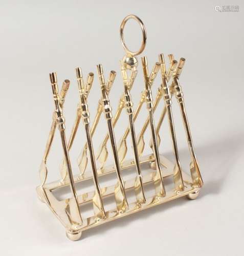 A SIX-DIVISION TOAST RACK, modelled as crossed oars.