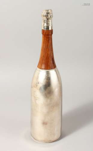 A CHAMPAGNE BOTTLE SHAPED COCKTAIL SHAKER.