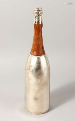 A CHAMPAGNE BOTTLE SHAPED COCKTAIL SHAKER.