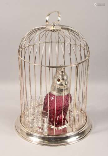 AN UNUSUAL LIQUEUR SET, modelled as a plated and glass parrot jug in a bird cage, with eight shot