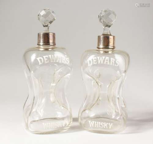 A PAIR OF DEWAR'S WHISKY HOURGLASS DECANTERS, with silver collars, marks rubbed. 10.5ins high.