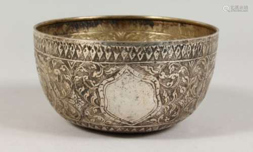 AN INDIAN CHASED AND ENGRAVED CIRCULAR SILVER BOWL. 6ins diameter.