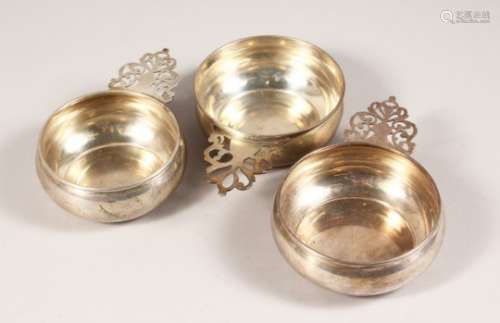A STERLING SILVER PORRINGER, and two similar. 4.5ins diameter.