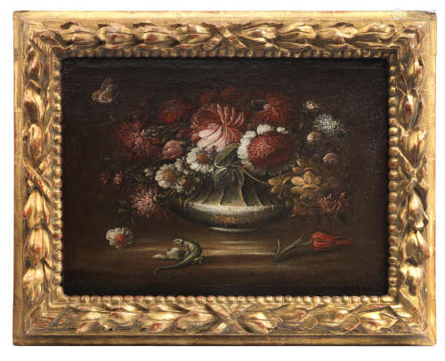 Circle of Paolo Porpora(Naples 1617-1673 Rome) Chrysanthemums, narcissi, poppies and other flowers in a silver gilt urn on a table-top with a lizard in a carved and gilt wood frame