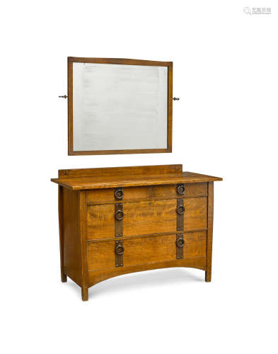 Chest of Drawerscirca 1910oak, wrought iron, with Gustav Stickley Craftsman paper label, together with a rectangular mirrorheight of chest 34 3/4in (88cm); width 48in (122cm); depth 22in (56cm)  Gustav Stickley (1858-1942)