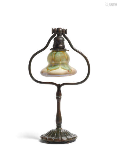 Harp Table Lampcirca 1910Favrile glass, patinated bronze, shade engraved 'L.C.T.', base stamped 'TIFFANY STUDIOS NEW YORK 424'height of base 17in (43.1cm); diameter of shade 5 3/4in (14.6cm)  Tiffany Studios (1899-1930)