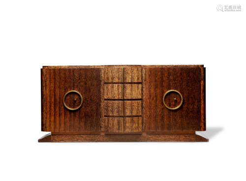 Sideboardcirca 1930palm wood, bronzeheight 40 1/2in (103cm); width 88 1/2in (225cm); depth 21 3/4in (55cm)  Décoration Interieur Modern (D.I.M.)