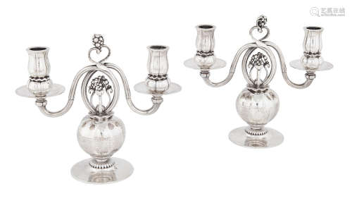 Pair of Two-light Pomegranate Candelabra1915-1932sterling silver, each with maker's hallmarks and personalized inscriptions on the undersidesheights 9 1/4in (23.4cm); widths 10in (25.4cm); depths 4in (10.1cm)  Georg Jensen (1866-1935)