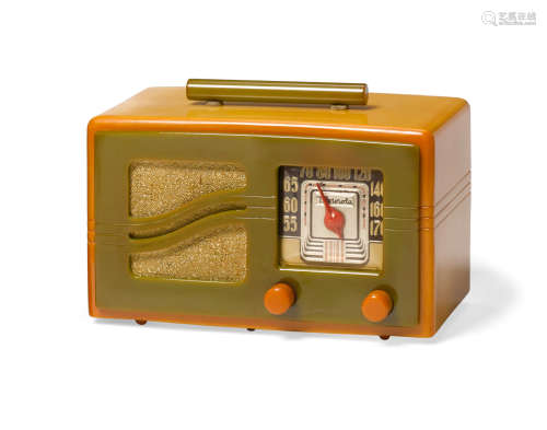 51X16 Radio 1941yellow catalin case and knobs, green handle, cloth grille, dial marked 'Motorola'height 6 3/4in (17.14cm); width 9 3/4in (24.7cm); depth 6 1/4in (15.87cm)  Motorola (Founded 1928)