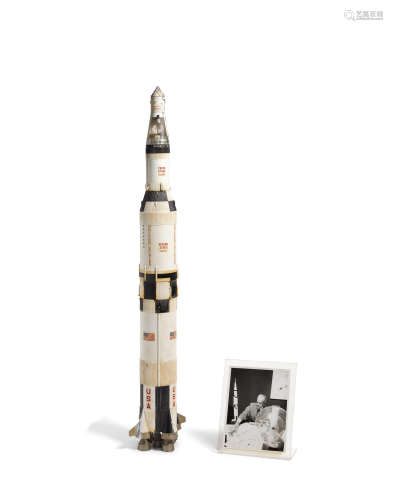 Studio Model of Saturn IV-B Rocket1960smodified by Raymond Loewy, plastic, acrylic and metal; together with a 1969 United Press International photograph of Raymond Loewy with his NASA related materials including this rocket model height approximately 40in (102cm); greatest diameter 5in (12.5cm)  American