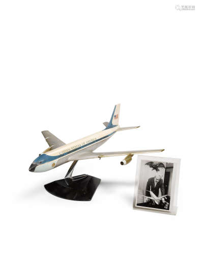 Studio Prototype Model #1 of Air Force One1962for the presidential administration of John F. Kennedy, plastic, fiberglass, chromed and enameled metal, signed in marker 'RL' and dated '62' on triangular base; together with a copy of a Loewy letter related to the airplane; and a 1967 photograph from United Press International showing Raymond Loewy with this model planeheight 15 1/2in(39cm); length 33in (84cm); depth 33in (84cm)  Raymond Loewy (1893-1986)