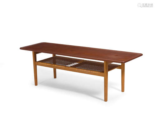 Coffee Tablecirca 1960model AT 10, for Andreas Tuck, teak, cane, stamped 'FABRRIKAT ANDR TUCK ARKITEKT HANS J WEGNER DENMARK'height 19 3/4in (50.1cm); width 63in (160cm); depth 19 3/4in (50.1cm)  Hans J. Wegner (1914-2007)