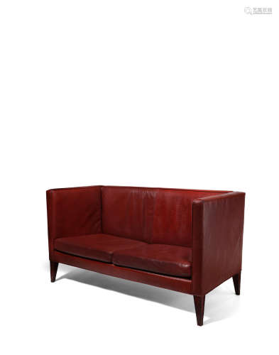 Custom Two Seat Sofacirca 2001stained alder wood, embossed and textured leatherheight 34 1/2in (87.6cm); width 63 1/2in (161.2cm); depth 29 1/4in (74.2cm)  Philippe Starck (born 1949)