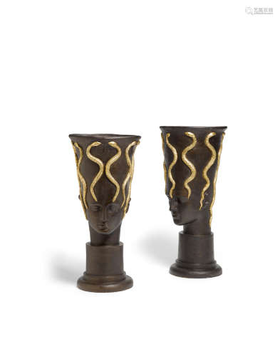 Pair of Footed Urns1990sfor David Gill, painted and gilt decorated ceramic, each stamped on underside 'H David Gill London'height of each 21 3/4in (55.2cm); diameter 10 1/2in (26.7cm)  Oriel Harwood (Active late 20th/early 21st century)