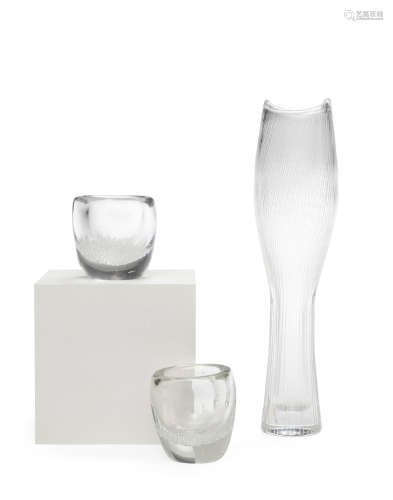 Line Cut Vase 1950sfor Iittala, engraved glass, etched 'TAPIO WIRKKALA IITTALA' on underside, together with two Kaj Franck bubble vases, glass, etched 'KAJ FRANCK IITTALA' on undersidesheight of line cut vase 13in (33cm); height of bubble vases 3in (7.5cm)  Tapio Wirkkala (1915-1985)