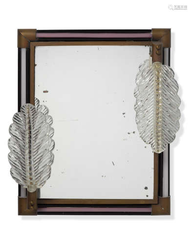 Illuminated Mirrormid 20th centuryglass with gold foil inclusions, plastic, brassheight 18 1/4in (46.4cm); width 14 3/4in (37.5cm); depth 4 1/4in (10.8cm)  Murano