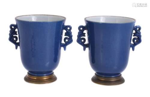 A pair of Samson powder-blue ground and gilt-metal mounted two-handled pot pourri urns in Kangxi sty