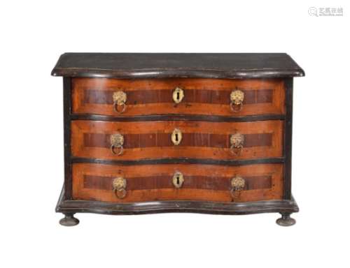 A South German walnut and ebonised cabinet maker’s model of a serpentine chest of drawers