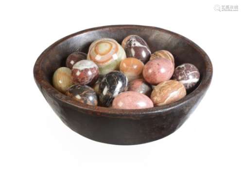A collection of polished stone specimen models of eggs and spheres