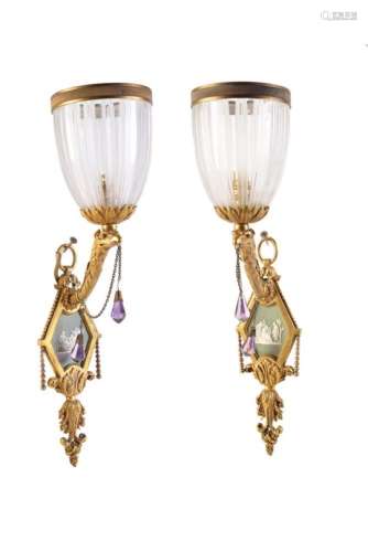 A pair of late Victorian gilt bronze, cut glass and porcelain inset wall lamps