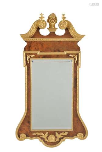 A burr walnut and parcel gilt wall mirror
