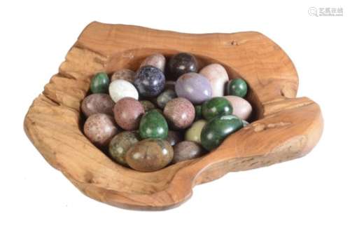 A collection of approximately 28 polished stone specimen models of eggs; to include examples in verd