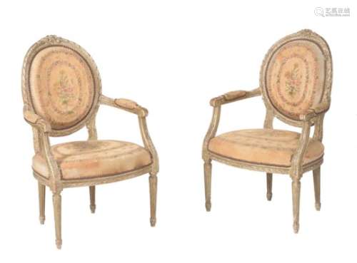 A pair of French green painted and tapestry upholstered armchairs in Louis XV style