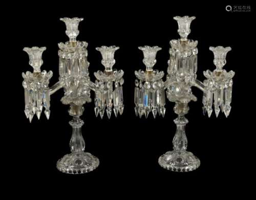 Baccarat, a pair of four light cut and moulded glass candelabra