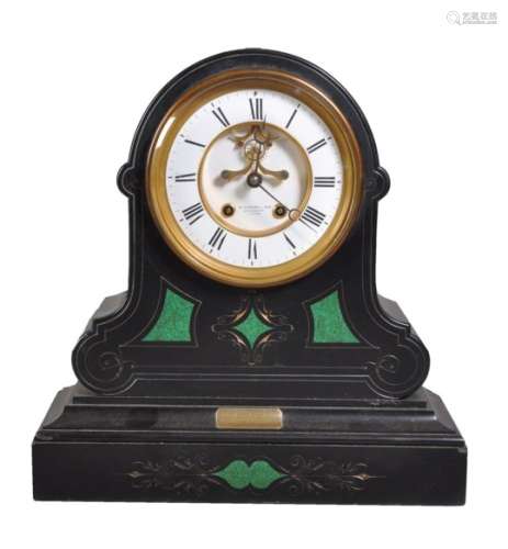A black marble and malachite inset mantel clock