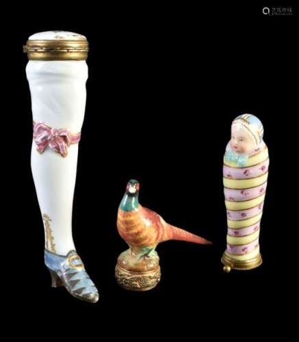 A Continental porcelain needle-case of a shapely leg in stockings