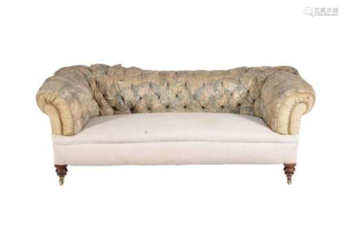 A Victorian walnut and upholstered sofa