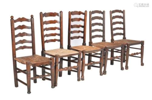 A harlequin set of thirteen beech ladder back dining chairs