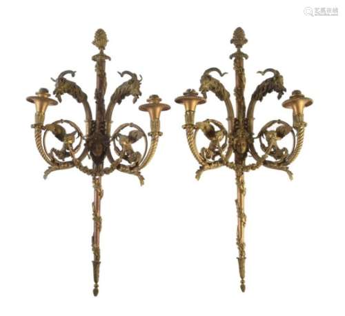 A pair of gilt bronze twin light wall appliques after designs by Pierre Gouthière (French