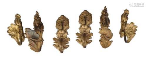 Three pairs of French gilt bronze curtain tie backs in Rococo taste