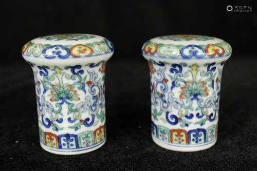 A Pair of Chinese Dou-Cai Glazed Porcelain Scroll Heads