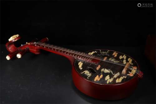 A Chinese Carved Lacquer Instrument - Lute
