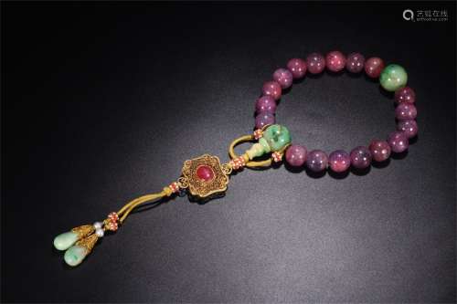 A Chinese Carved Ruby Payers Beads