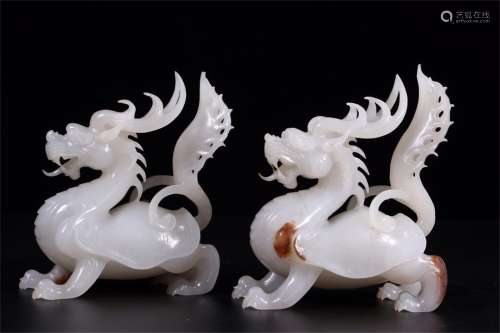 A Pair of Chinese Carved Jade Foo-Dogs